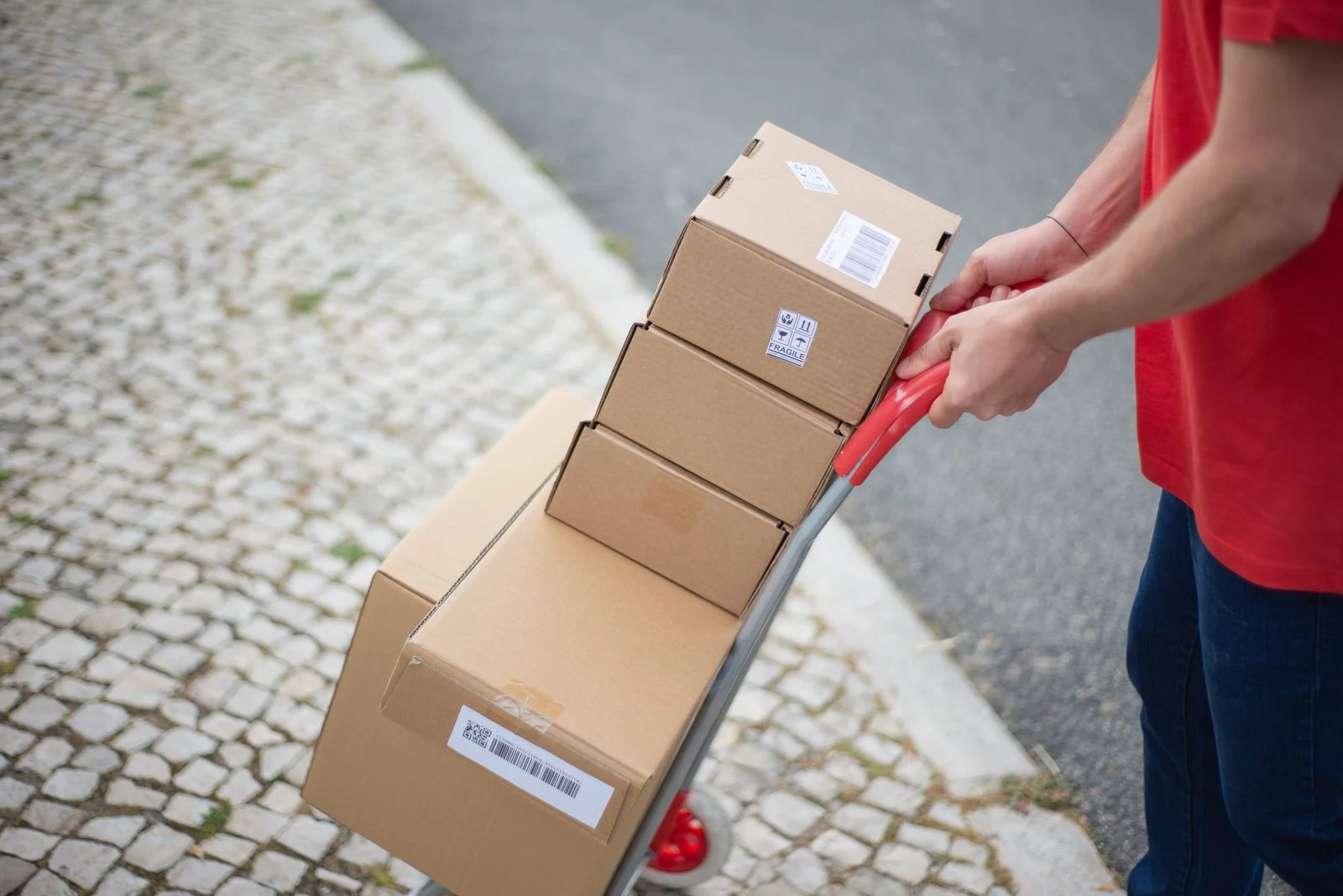 courier boxes on hand truck for return friendly ecommerce shipping
