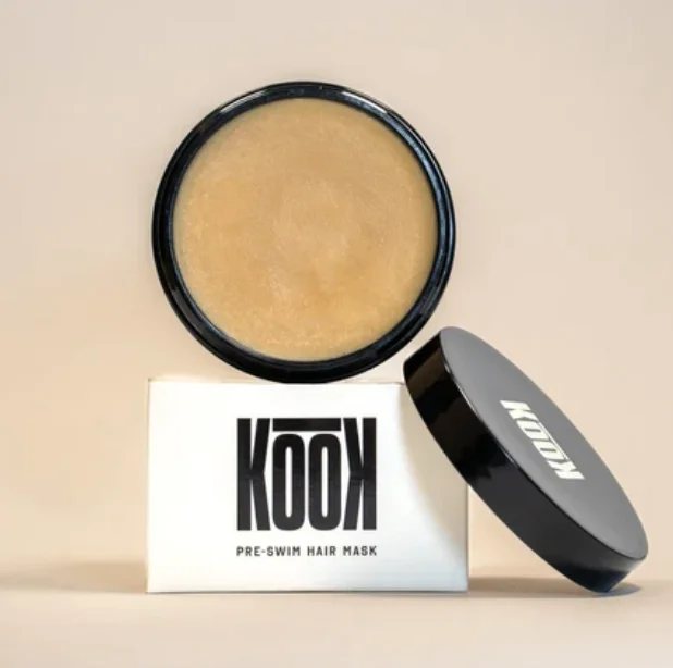 KOOK skincare cream and jar in pale pistachio packaging