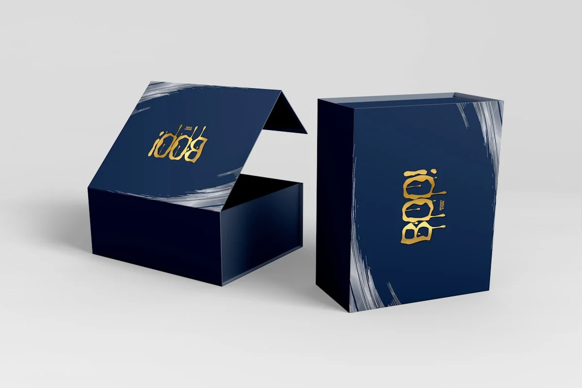 Blue rigid box with gold logo showing custom branding options for packaging design