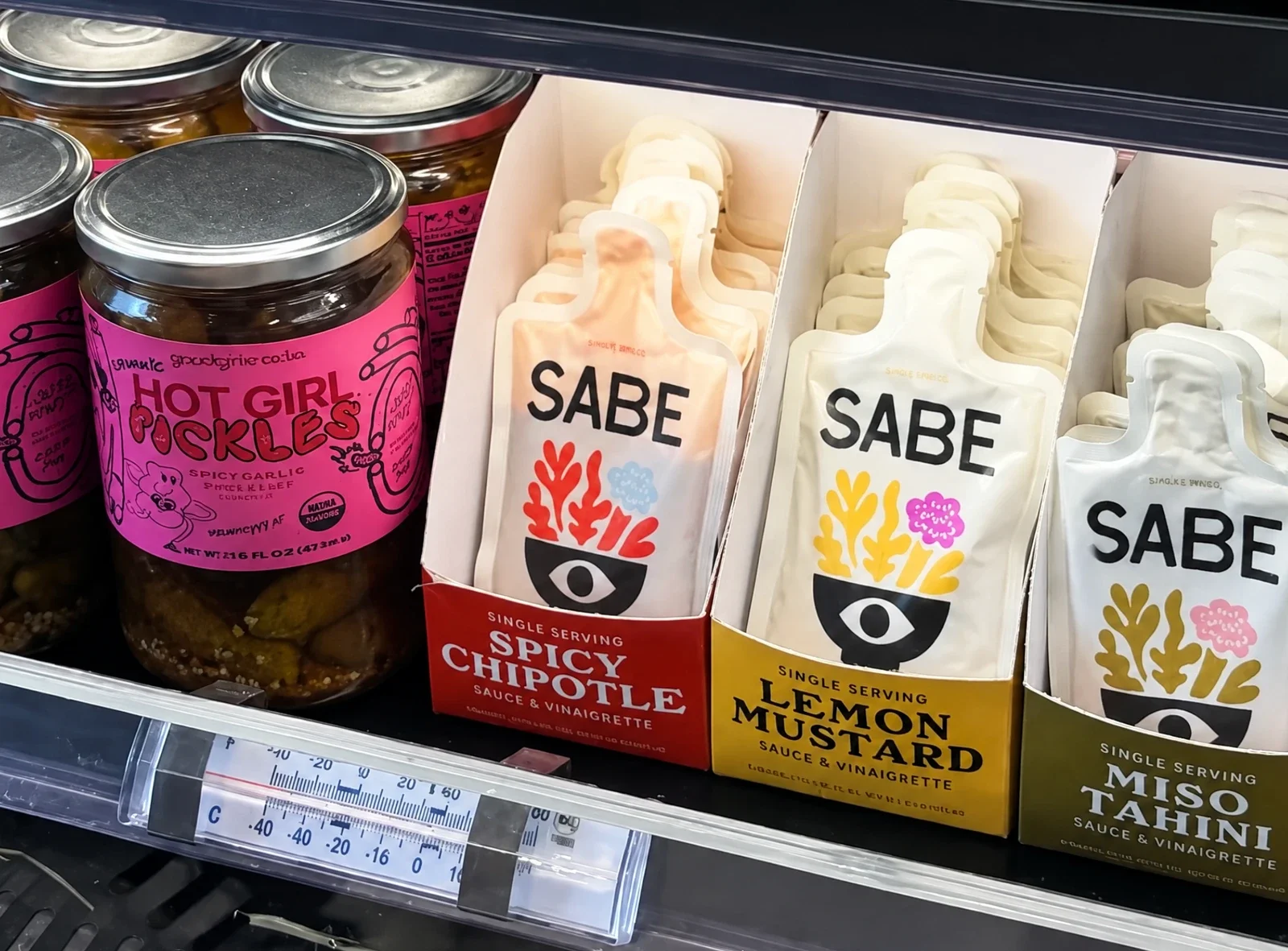 SABE sauce pouches on a store shelf