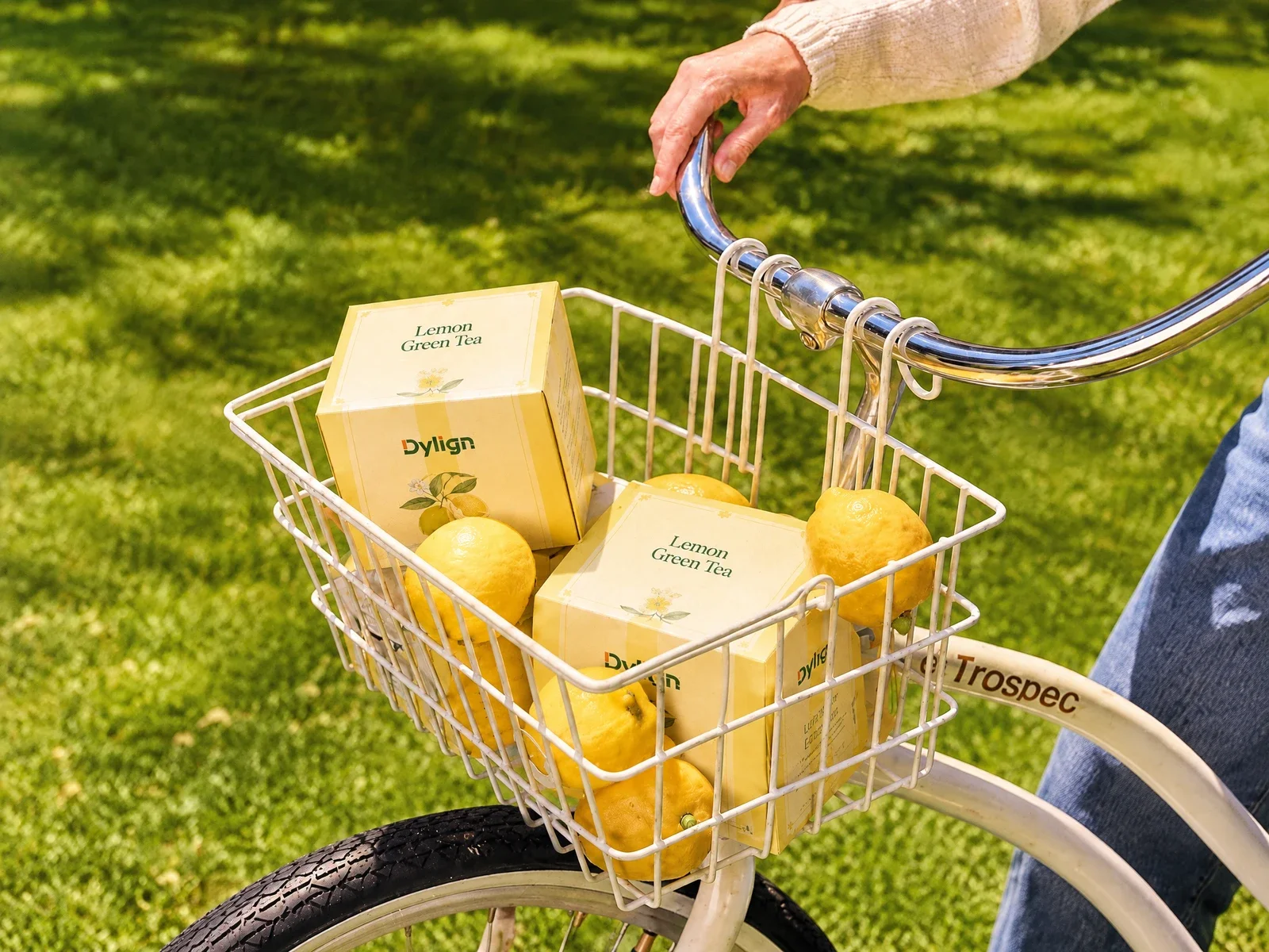 Lemon tea cartons in a bicycle basket