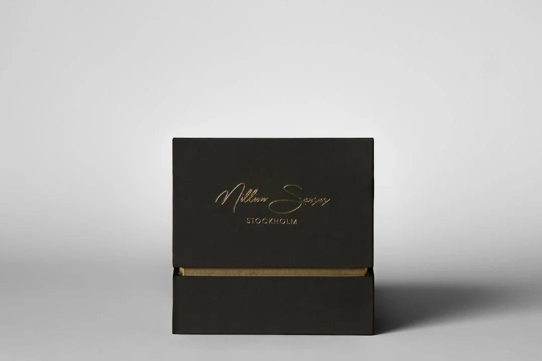 Black rigid box with gold foil stamping - premium packaging materials