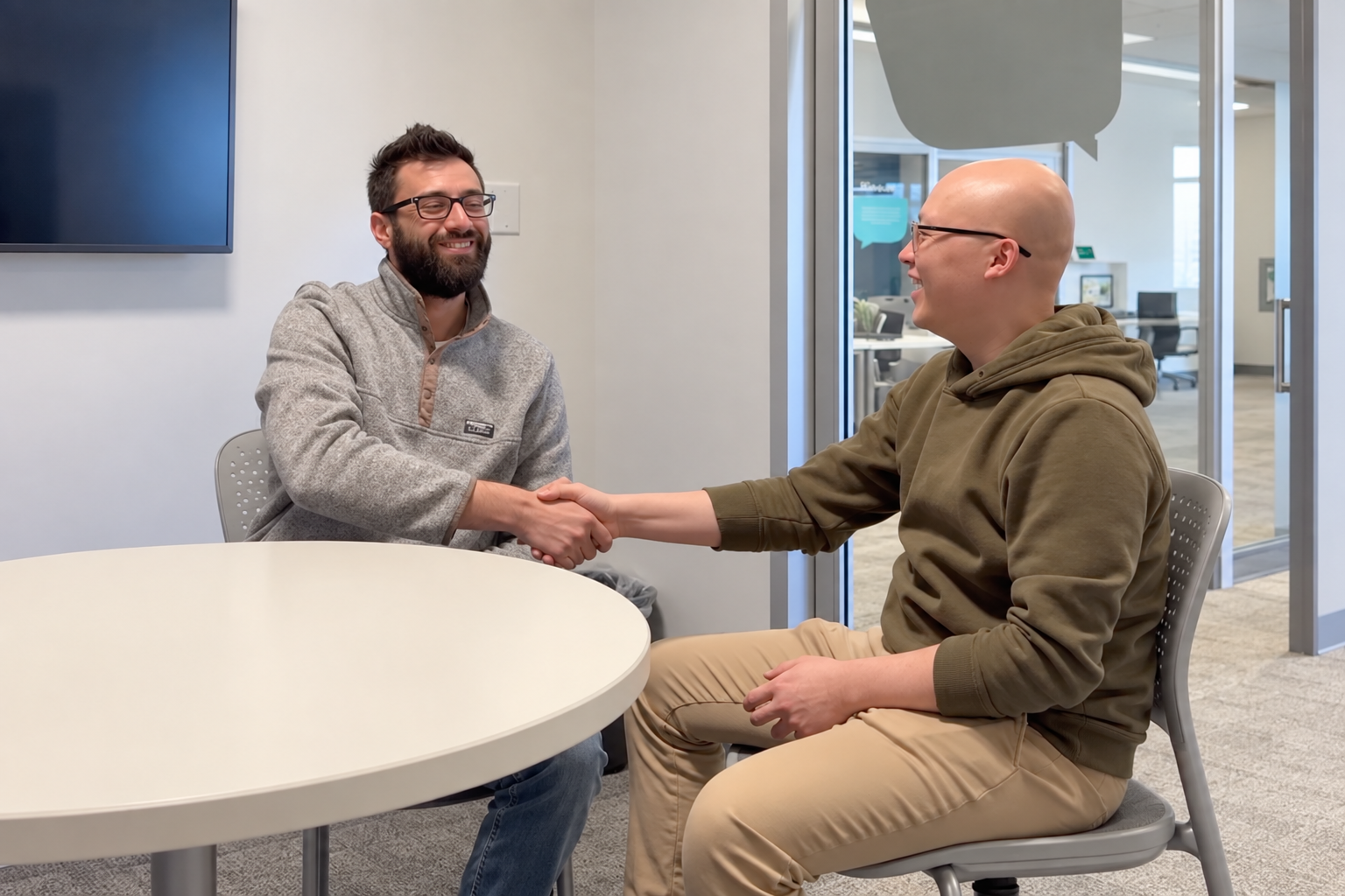 PHiSTiK founder shaking hands with a packaging partner