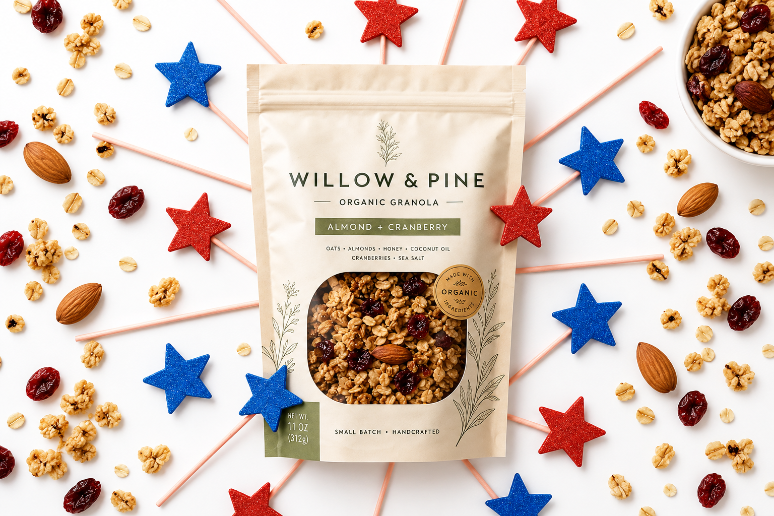 A Willow & Pine granola pouch is surrounded by granola ingredients and red and blue decorative stars.