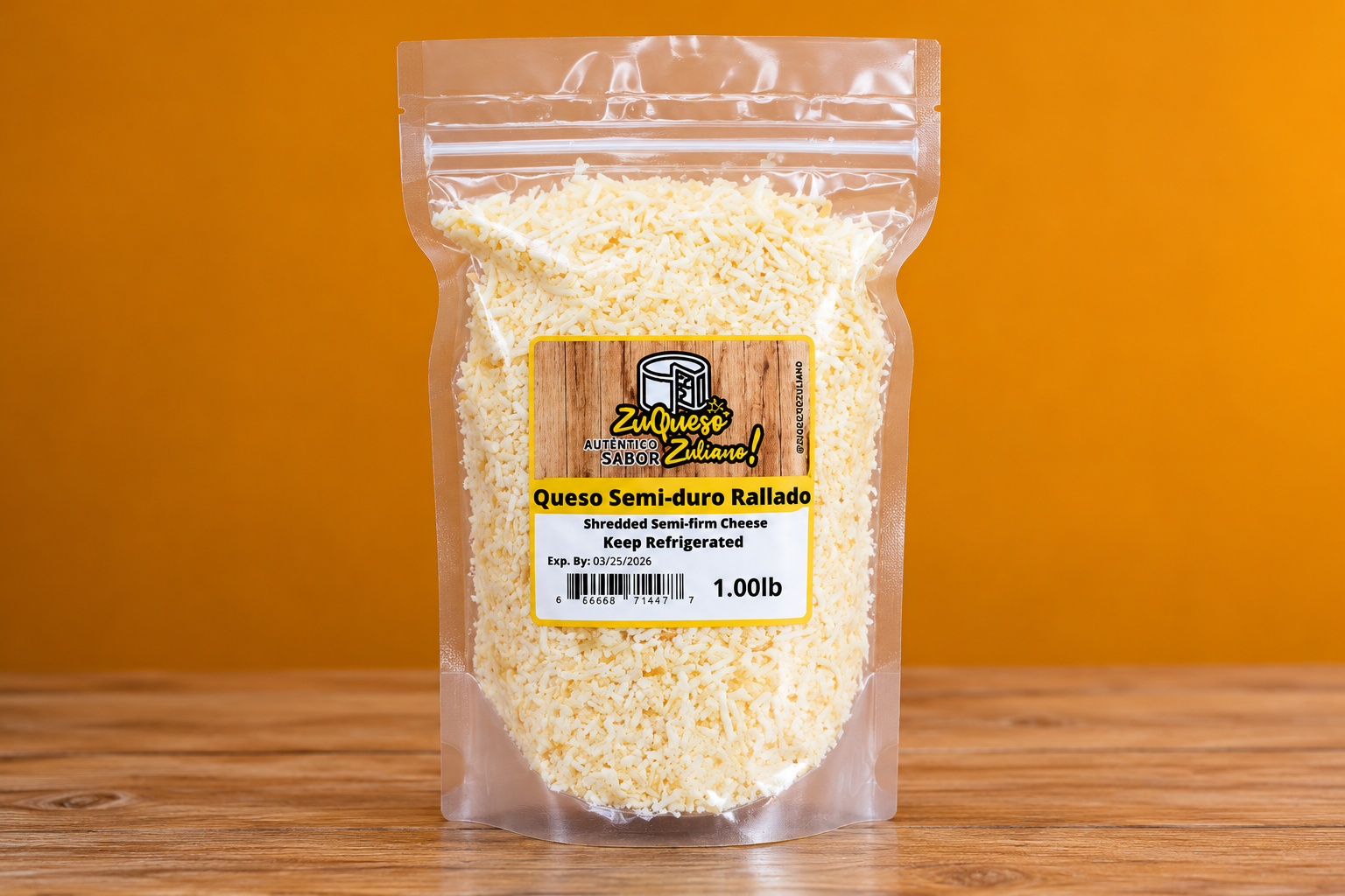 A clear Zuqueso Zuliano pouch of shredded semi-soft cheese stands on a wooden surface.