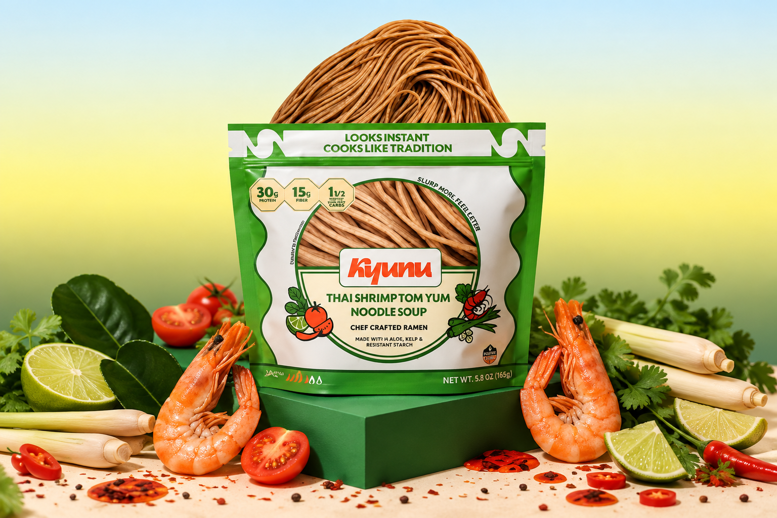 A green KYUNU Thai shrimp tom yum noodle soup pouch is displayed with shrimp, lime, tomatoes, and herbs.